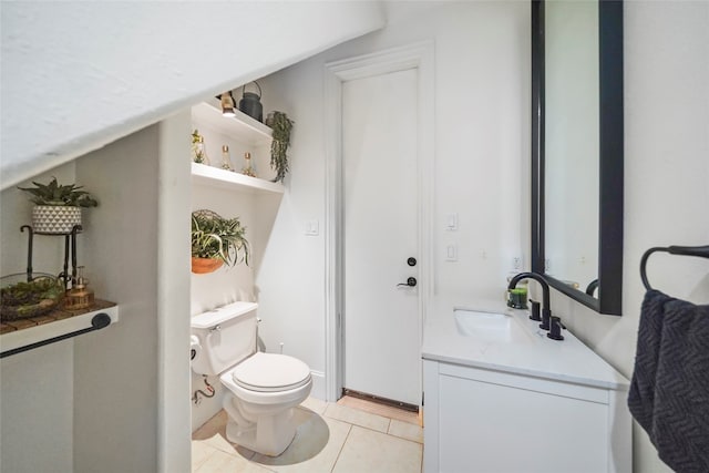 bathroom with vanity, toilet, vaulted ceiling, and tile patterned flooring