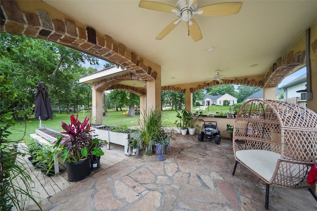 view of patio featuring ceiling fan