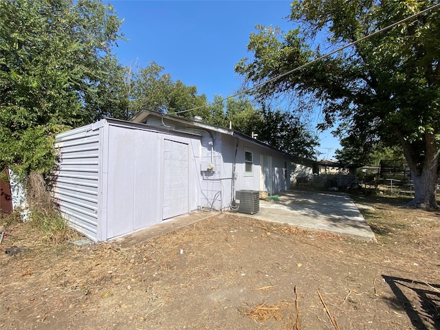 exterior space featuring central AC unit