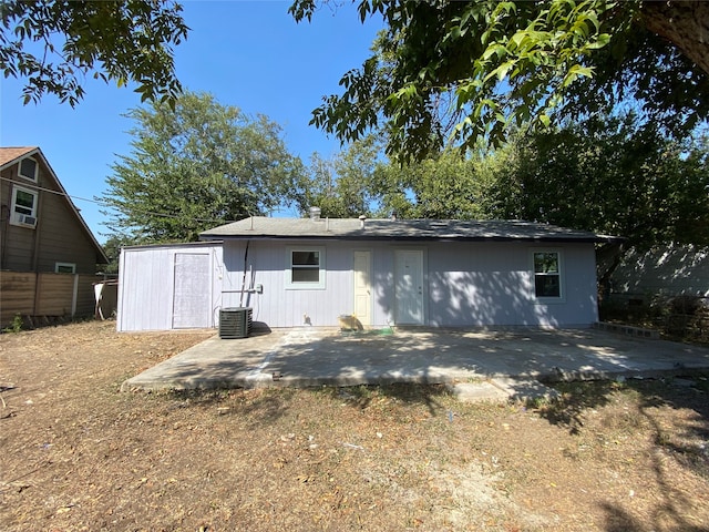 rear view of property featuring a patio and cooling unit