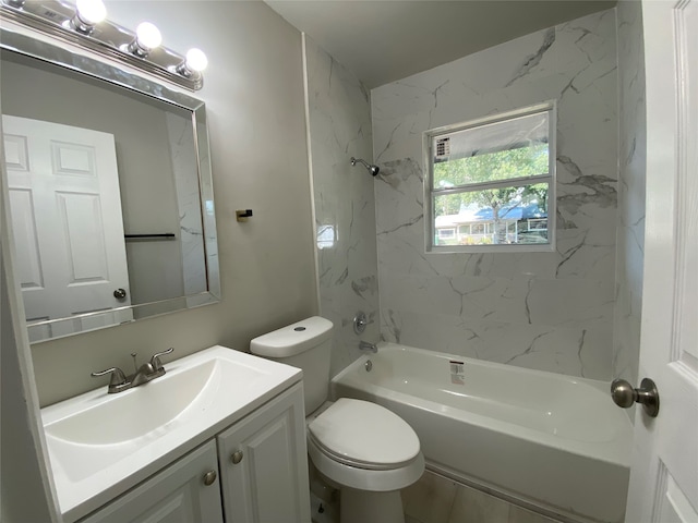 full bathroom featuring tiled shower / bath, vanity, and toilet