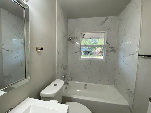 full bathroom featuring vanity, toilet, and tiled shower / bath combo