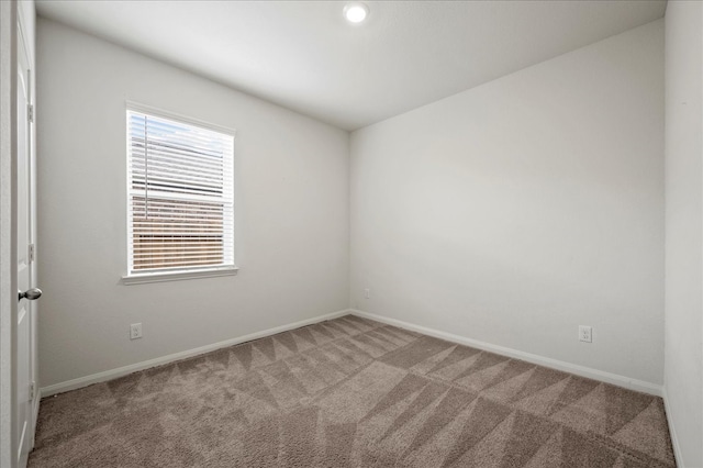 unfurnished room featuring carpet flooring