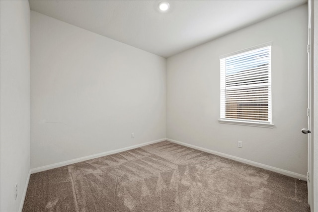 unfurnished room featuring carpet flooring