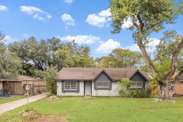 ranch-style house with a front lawn