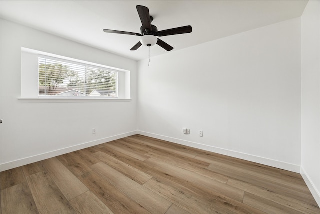 spare room with ceiling fan and hardwood / wood-style floors