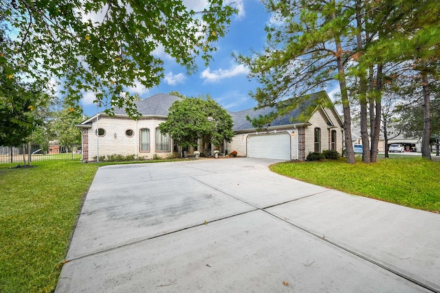 view of front of property with a front lawn and a garage