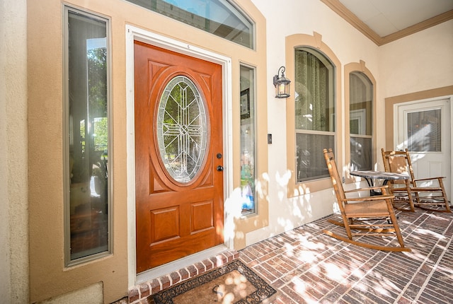 doorway to property with covered porch