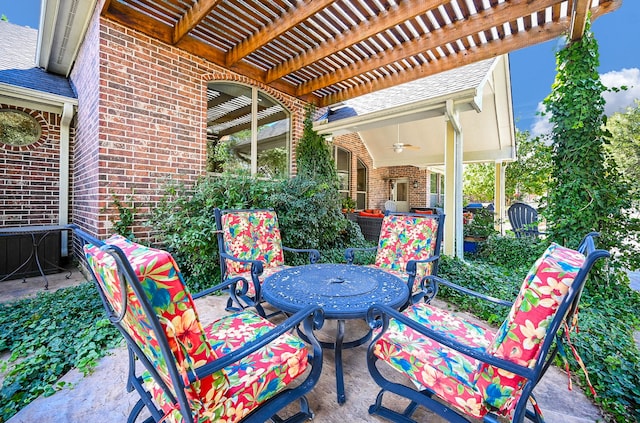 view of patio featuring ceiling fan and a pergola