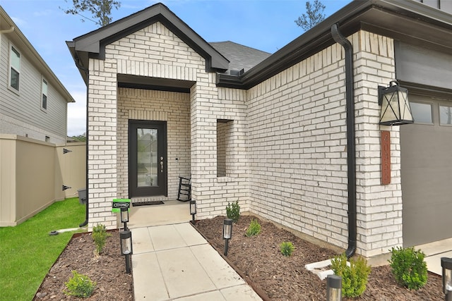 doorway to property featuring a garage