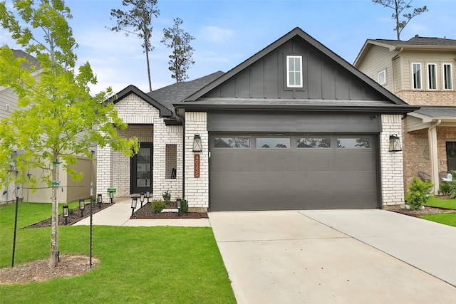 craftsman inspired home featuring a front yard and a garage