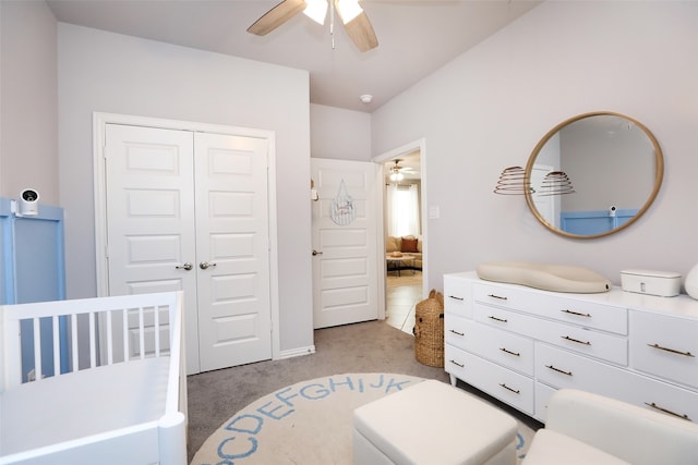 carpeted bedroom with a closet and ceiling fan