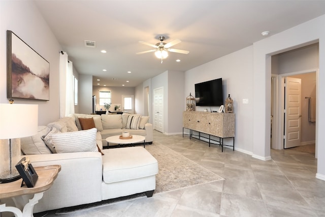 living room featuring ceiling fan