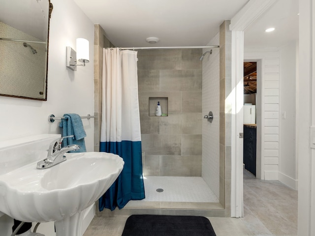 bathroom with sink, tile patterned floors, and a shower with shower curtain