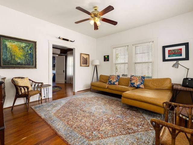 living room featuring dark hardwood / wood-style floors and ceiling fan