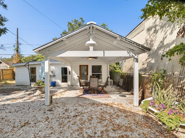 rear view of property featuring a gazebo, a patio area, and ceiling fan