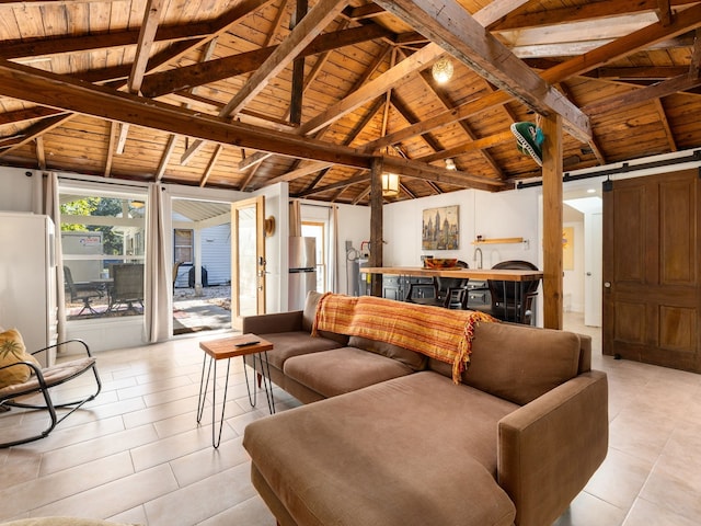 tiled living room with wooden ceiling, vaulted ceiling with beams, and a barn door