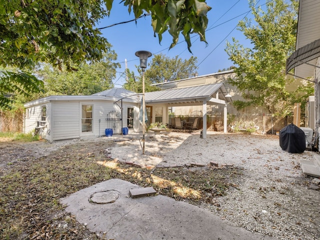 back of property with a patio area