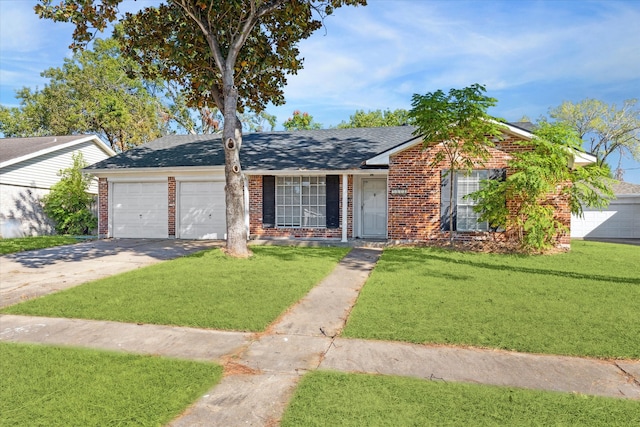 ranch-style home with a garage and a front lawn