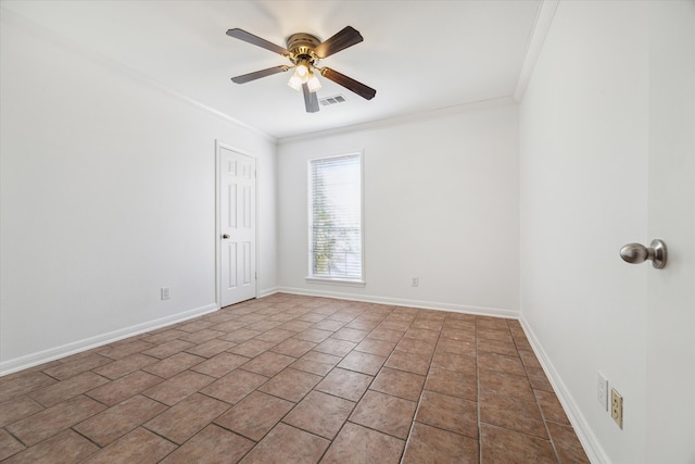 tiled spare room featuring ornamental molding and ceiling fan