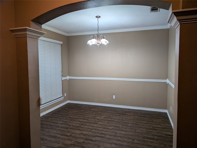 unfurnished room with an inviting chandelier, crown molding, and dark hardwood / wood-style floors