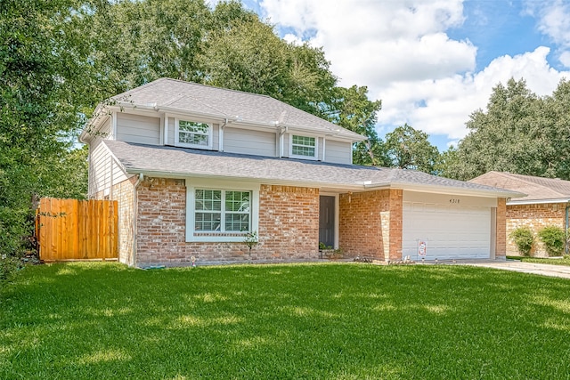 front of property featuring a front yard and a garage