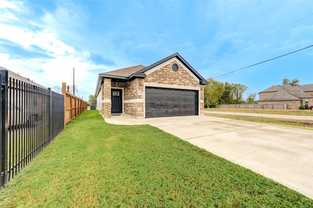 view of front of property with a front lawn and a garage