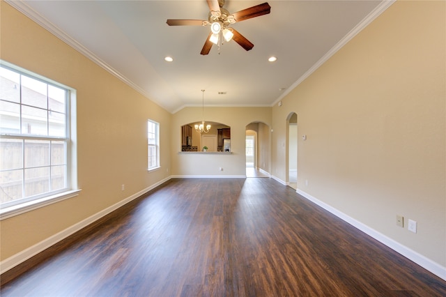 unfurnished living room featuring dark wood-type flooring, ceiling fan with notable chandelier, and crown molding