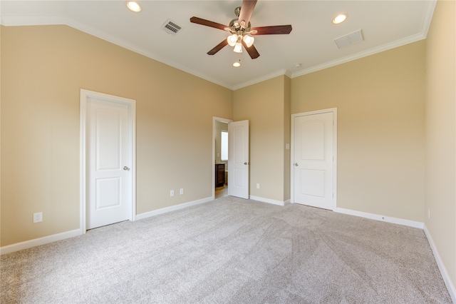 unfurnished bedroom with ornamental molding, light carpet, and ceiling fan