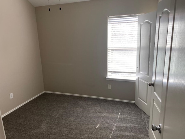 carpeted spare room featuring a healthy amount of sunlight