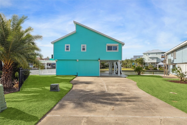 exterior space with a yard and a carport