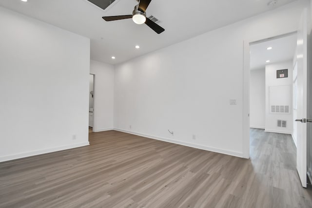 unfurnished room with light wood-type flooring and ceiling fan