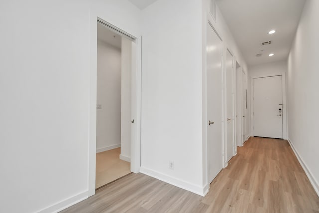 hallway featuring light hardwood / wood-style flooring