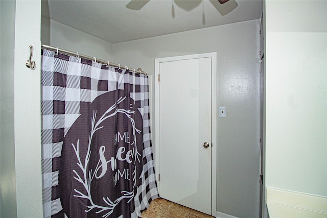 bathroom featuring tile patterned floors and ceiling fan