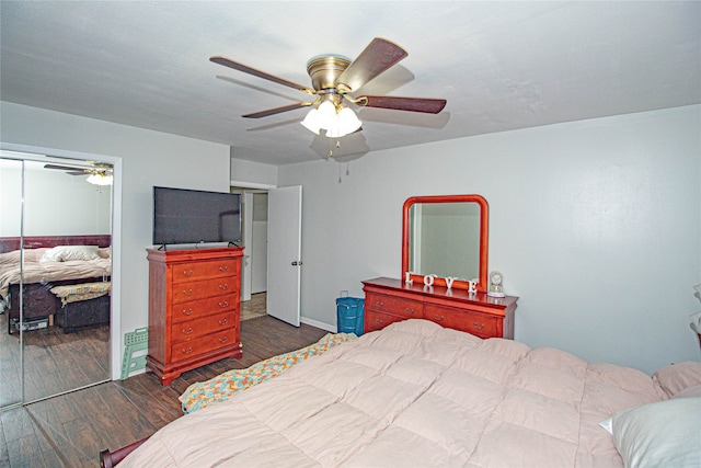 bedroom with a closet, ceiling fan, and dark hardwood / wood-style floors