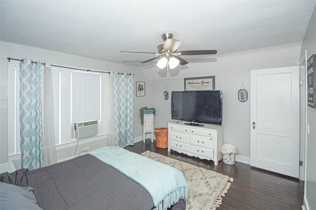 bedroom with ceiling fan, cooling unit, and dark hardwood / wood-style flooring