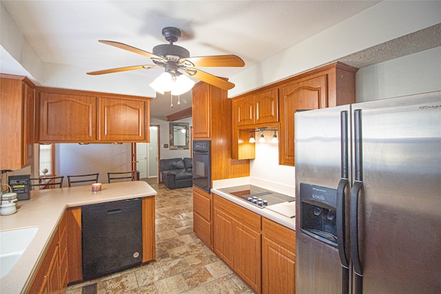 kitchen featuring ceiling fan, black appliances, and sink