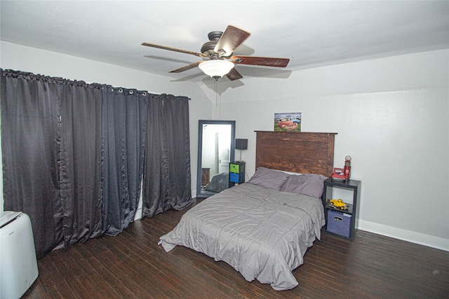 bedroom with dark wood-type flooring and ceiling fan