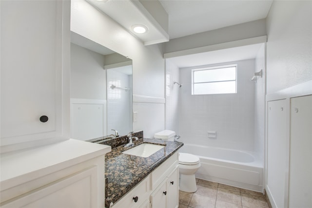 full bathroom with vanity, toilet, tiled shower / bath combo, and tile patterned flooring