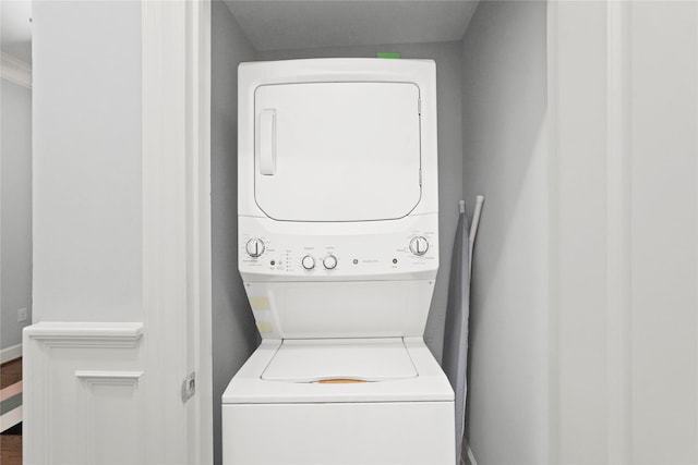 2802 Morrison St Unit 206, Houston, TX 77009 - laundry area featuring wood finished floors, stacked washer / dryer, and laundry area