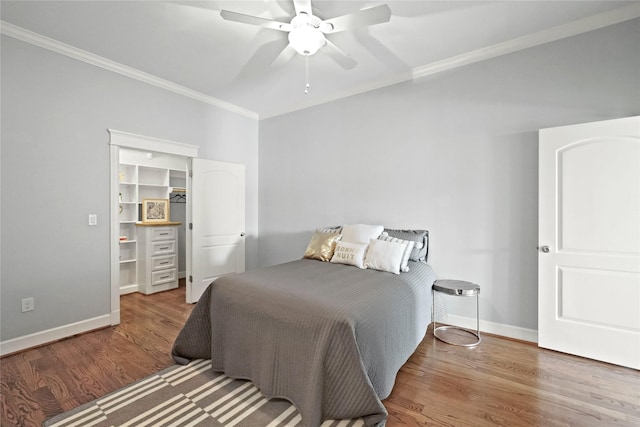 2802 Morrison St Unit 206, Houston, TX 77009 - bedroom with wood finished floors, a spacious closet, crown molding, and baseboards