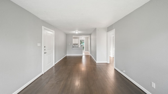 foyer entrance with dark hardwood / wood-style floors