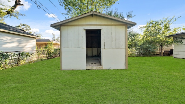 view of outbuilding with a lawn