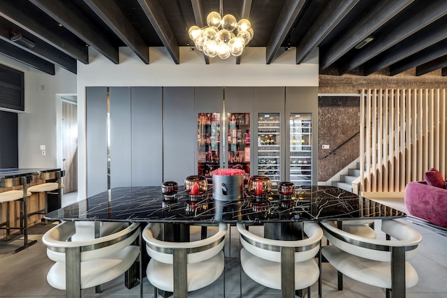 kitchen with a notable chandelier and beamed ceiling