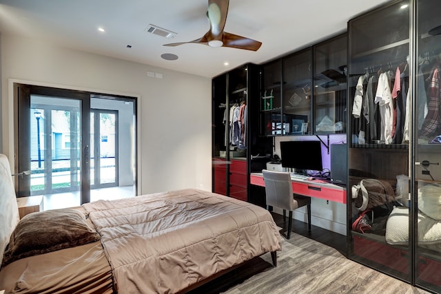 bedroom featuring ceiling fan and hardwood / wood-style flooring