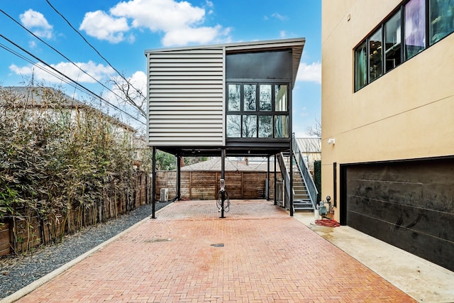 view of patio featuring a garage and a carport