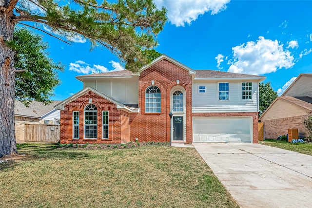 view of front of property with a front lawn and a garage