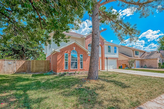 view of front of property with a front lawn and a garage