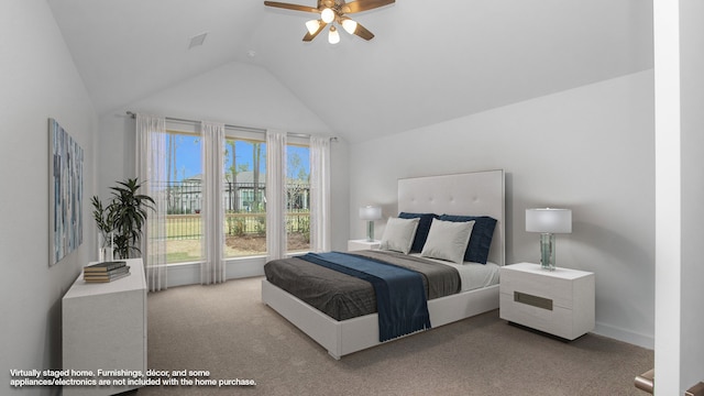 carpeted bedroom with ceiling fan and lofted ceiling