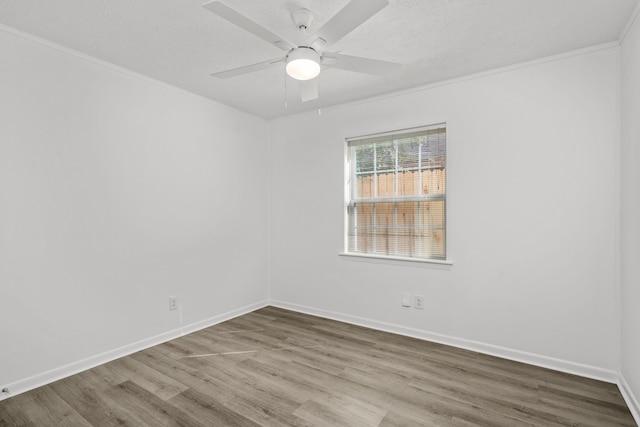 unfurnished room featuring a textured ceiling, crown molding, hardwood / wood-style flooring, and ceiling fan